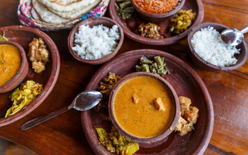 close up view of traditional asian food on wooden tabletop, sri lanka